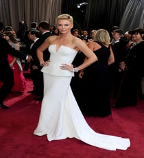 Charlize Theron
The truth is, Charlize Theron could show up wearing a Hefty bag and we'd still think she looked breathtaking. But last night, she didn't. Instead, the graceful and gorgeous Theron opted for a clean, white Dior Haute Couture floor-length gown with a peplum waist. The only accessories Theron added were two sparkling bracelets — fitting, since her short hair and crisp neckline lent itself to minimalistic perfection.
Photo: Stewart Cook/Rex/Rex USA
Charlize Theron 2013 Oscars