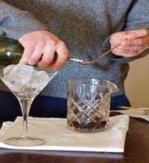 Add ice to a martini glass to chill it. Pour liquid ingredients into a mixing glass. 03_Step-2