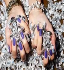 "Shimmer is always a good option for New Year's Eve," Barokas says. We couldn't agree more. Here, she created a multidimensional look by layering The New Black polish in 24 Hour Party Purple over a base of CoverGirl Outlast Stay Brilliant Nail Gloss in Vio-Last.
Capwell + Co Curb Chain and Crystal Magnetic Bracelet, $32, available at Capwell + Co; Capwell + Co Silver Rectangle Graduated Toggle Bracelet, $28, available at Capwell + Co. 03_REFINERY_29_NAILS_DEC_SHOT_3_021