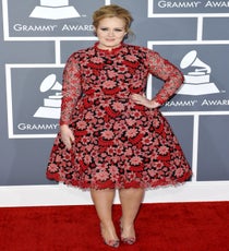 Adele
Wait, who is this lovely diva wearing a shorter Valentino confection? It cannot possibly be, can it? But, she always wears black, doesn't she? And yet, here she is, in what appears to be a red, voluminous, embroidered skirt with matchy-matchy floral pumps, defying all expectations. And we like it. (P.S. We caught your new "A" tattoo, Adele. Is that for Angelo?)
Photo: Picture Perfect/Rex USA rexusa_1235245s