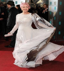 Helen Mirren
You already know how much we love her candyfloss hair but Helen Mirren's Nicholas Oakwell couture dress was pretty wonderful, too. The pale-gray tones of the chiffon gown were the perfect foil to the sweetie-shop pink — and it was a real pleasure to see a woman on the red carpet having fun with her look. No left-arm-at-right angle poses for this Dame, just a playful twirl for the cameras. Pure class.
Photo: David Fisher/Rex/Rex USA rexusa_1235223dz