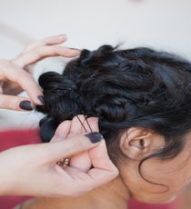 Step 8: Now repeat on the top right section: Split into two, knot, secure, and pull back fringe with bobby pins. 24_32_style3_step8