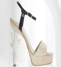 An elegant '40s-inspired shape with a high-drama, sculpted, coral heel.
Chanel Coral-inspired high heel, available in Chanel stores.
Chanel-7