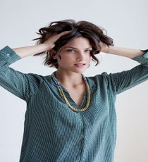 Use your fingers to shake out and separate the curls. Spritz on some texturizing spray, like Bumble and bumble Surf Spray, to bring out the texture and really enhance your natural wave. Bonus: If your hair is greasy, the Surf Spray will help suck up some of the oil and mattify your roots.
Joie Marlo D Top, Noise Girl Lyle Necklace quick-beauty-4