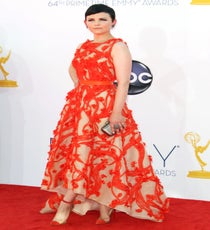 Presenter Ginnifer Goodwin's stark pixie cut never looked better than paired with a poppy orange gown by L.A.'s own atelier Monique Lhuillier. We love when it's readily (and stunningly) apparent how much energy was put into an outfit, and this organza embroidery had to have taken unimaginable hours to sew. Throw in some superbly matched ankle-strap Bis Un Bout Loubies and some edgy Rona Pfeiffer danglers, and you have one perfectly strategized ensemble. Photo: Matt Baron/BEImages emmys-dresses-ginnifer-goodwin