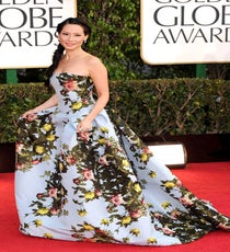 Lucy Liu
We've heard every critique in the book about the Elementary actress' Carolina Herrera gown (drape and wallpaper-inspired included). But, no matter where you stand on the decor debate, one thing's for certain: We'd love to take this sucker home with us. Like night and day, this dress is the complete opposite of Lucy Liu's skin-tight sequined frock from the Emmys. We love ourselves a fashion risk, and opting for a theatrical floral number certainly paid off.
Photo: David Fisher/Rex/Rex USA Lucy-Liu