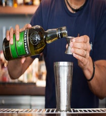 Step 4: Pour in the Green Chartreuse and jalapeño syrup. 047_SpicyCocktails_4th