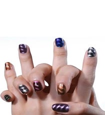 The drugstore overachiever debuts 8 trendy colors (we're digging Kinetic Copper) and come with a built in magnet, so these bad boys won't set you back a ton of dinero.
Sally Hansen Magnetic Nail Color, $8.99, available at Target. Sally Hansen