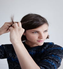Grab a small section of hair a few inches away from the hairline and begin creating a tiny, three-strand braid. Williams says you want the braid away from the hairline so that you can see some movement at the front of the hair — it makes the braid act more like an accessory. Use a small elastic to secure at the end.
Theory Tommie C Sweater quick-beauty-9