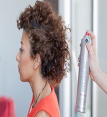 Step 11: Spritz with hair spray, then with shine spray. 12_11_style1_step10