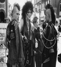 Anarchy In The U.K.
The everlasting effect of punk in fashion is the theme of this year's MET Gala, and for good reason: The advent of punk was the first time fashion, societal anxiety, and music all coalesced on such an international scale. The March 25 issue of the New Yorker quotes Andrew Bolton, the MET curator who is behind the upcoming exhibit, saying, "Punk in London was music-based, but it quickly became a political, class-conscious thing."
In his seminal book on subculture, theorist Dick Hebdidge points out a similar reason youths embraced the denim in the '50s. By taking middle-class clothes, like ties, denim, work shirts, and vests, and aggressively destroying with holes, pins, and chains, punks were defying '70s Thatcherite blue-collar norms. Says Bolton, "It was a very depressed time in London, and working-class kids were acting out the realities of being on the dole. The battle cry of the Sex Pistols was 'No future — no future for you and no future for me.'" While no formal revolution took place, music and style helped send a disruptive worldwide message.
Photo: Feri Lukas/Rex USA punk