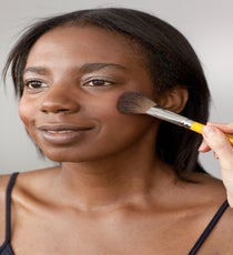 Using a large fluffy brush, apply a pink blush to the apples of the cheeks. 20_HalloweenLook3_091512_026