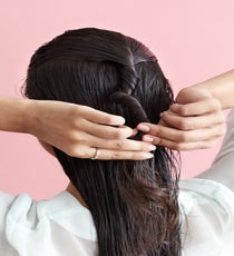 Twist the sectioned-off hair tightly, until it starts to fold in on itself, creating a bun. MultiBun_040_R