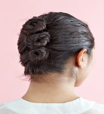 The Bun Ladder
This style is a unique, funky twist on the basic bun. It can be left up or let down once it dries to create wavy, surfer-girl texture. The trick is to keep the style a bit loose, so that hair actually dries. MultiBun_194_R