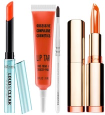 Orange Lips
Maybe it’s because it looks like you’ve just slurped down a tasty ice pop, but orange lipstick just gives us those summertime vibes. And, when we say orange here, we mean orange — corals, though perfectly lovely, just don't pack the same punch. Afraid you won't find the perfect shade? Cherman says you will. “The lighter your skin tone, the lighter shade of orange you’ll want to choose," she says. "Look for a vivid tangerine if you have darker tones, or a soft cantaloupe for more fair complexions.” Extra points for going full matte with this trend.
Bare Escentuals BareMinerals Remix Loud & Clear Lip Sheer in Tangerine Trace, $15, available at Sephora;
Obsessive Compulsive Cosmetics Lip Tar in True Orange, $18, available at Sephora;
Clarins 'Instant Smooth' Crystal Lip Balm in Crystal Mandarin, $26, available at Nordstrom.
Orange_lips