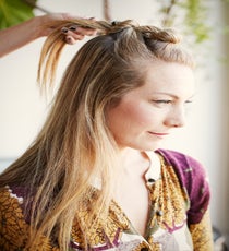 Step 4: Begin to twist and tie into a second knot just below the first. Secure with a bobby pin. style2_step4