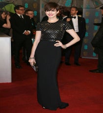 Anne Hathaway
Congratulations to Annie Hathaway, winner of the Best Supporting Actress award and wearer one of our favourite looks of the night. Rumours proved unfounded that the Les Mis actress would wear Lanvin, as she confidently walked the red carpet in Burberry. Plus, her elfin crop is really growing on us, and although studs have been a embellishment of choice for seasons now we liked how these add-ons gave the plain black column an edge.
Photo: Matt Baron/BEImages rexusa_1235232r
