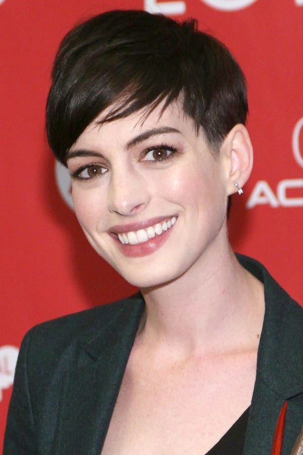 Anne Hathaway | Slightly grown out pixie haircut with heavy beveled bangs